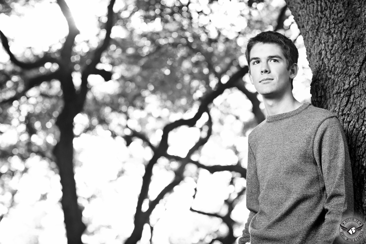 Black and white picture of high school senior boy in Austin at the Arboretum 